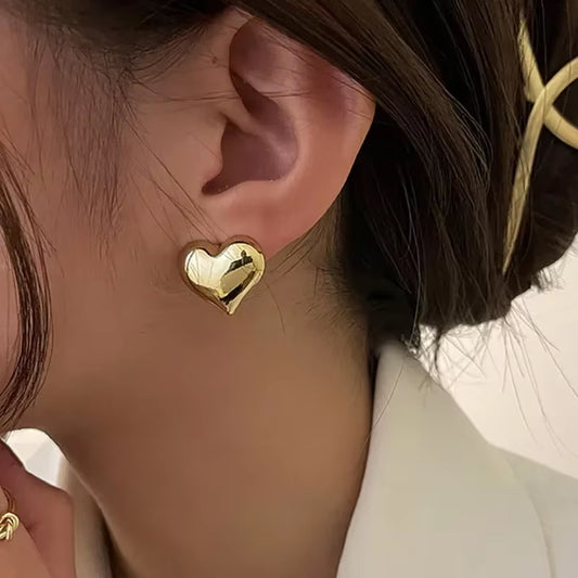 ATLASORA Gold Color Smooth Surface Love Heart Shaped Stud Earrings — Minimalist Fashion Jewelry for Women, Perfect for Weddings and Bridal Looks.